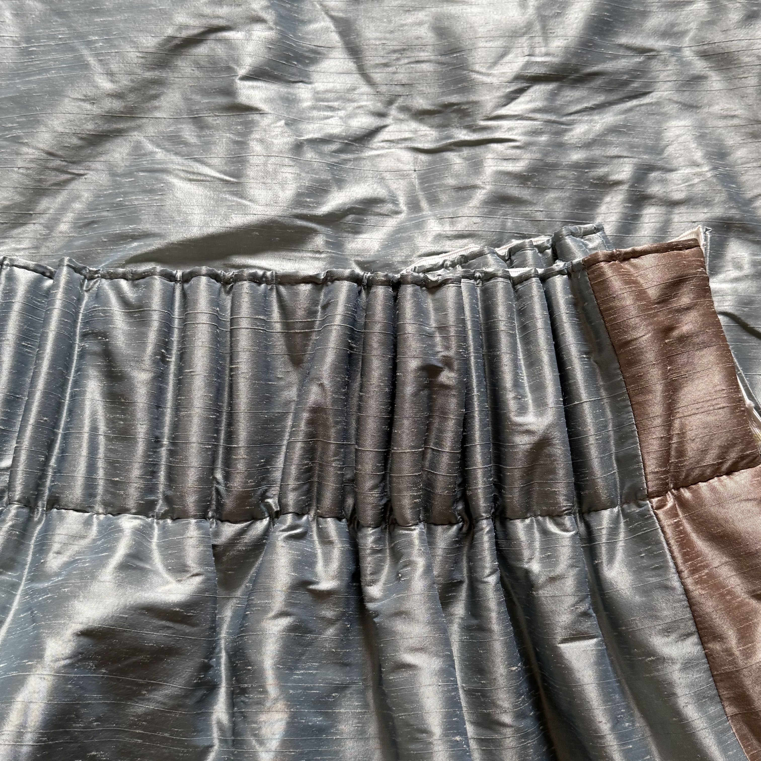 Pale Blue Silk Slub Curtains With Contrasting Mink Coloured Border on Leading Edge